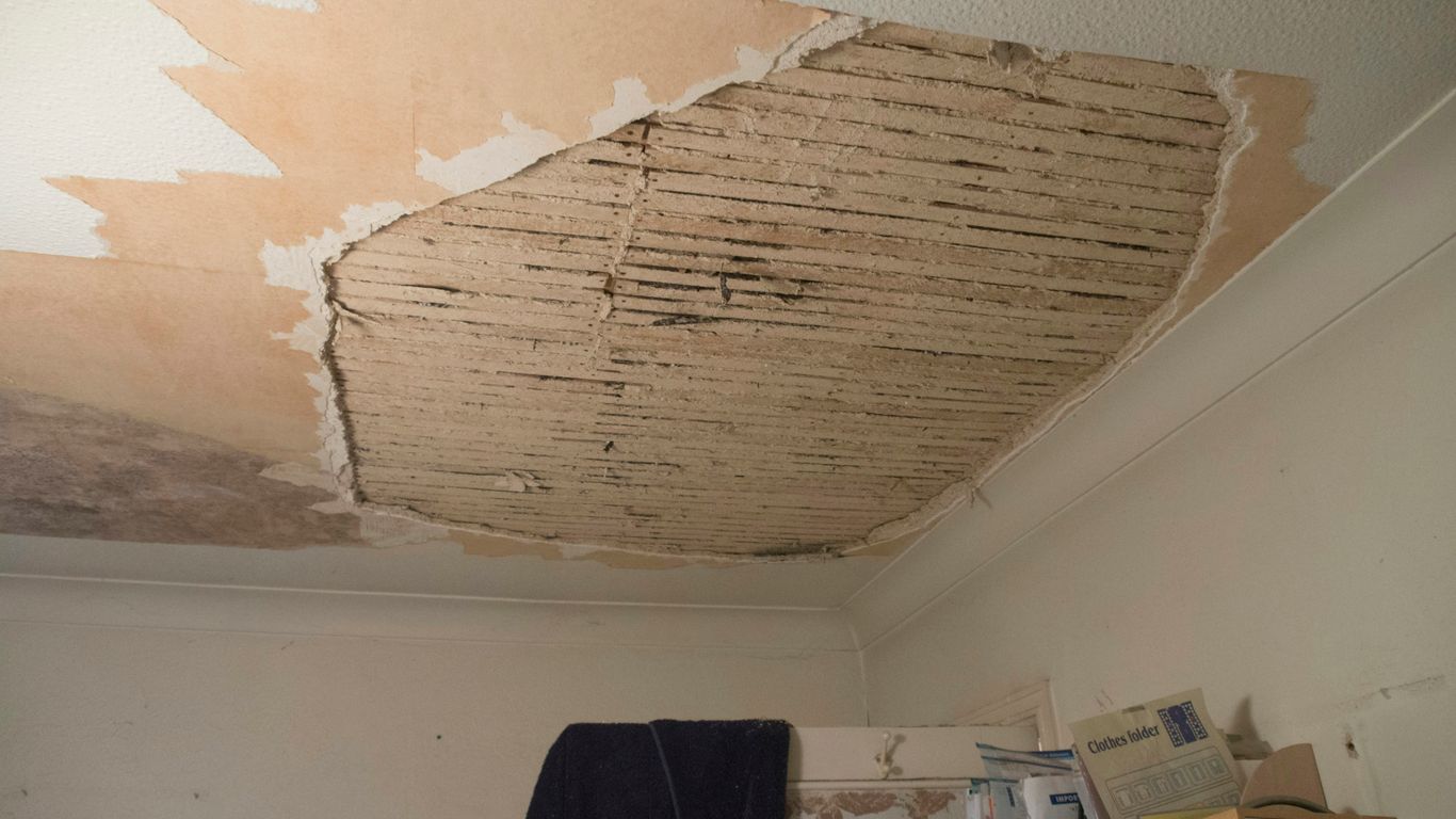 A room with a ceiling that has been torn off